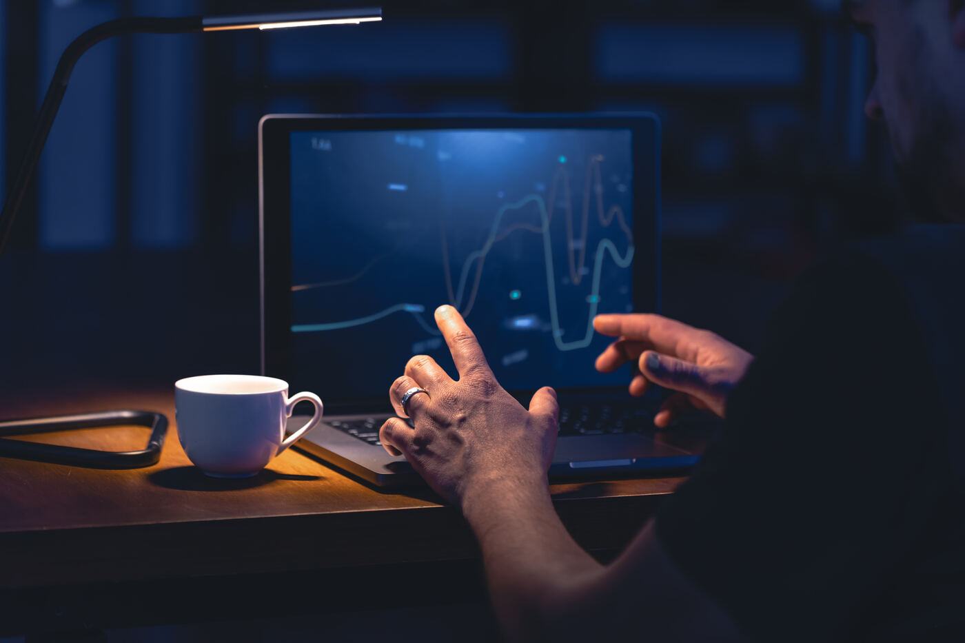 Analyzing performance charts on a laptop